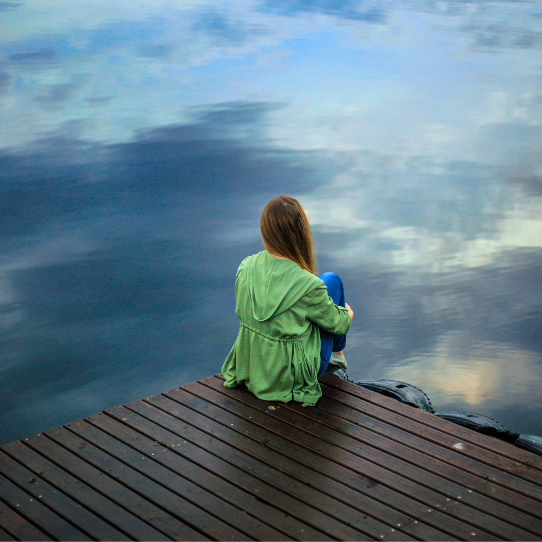 Woman on dock addressing stress.